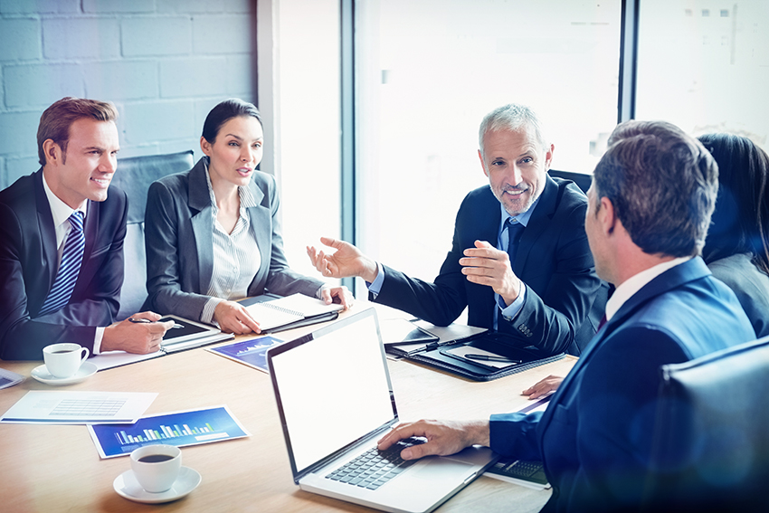 Businesspeople discussing together in conference room during meeting at office